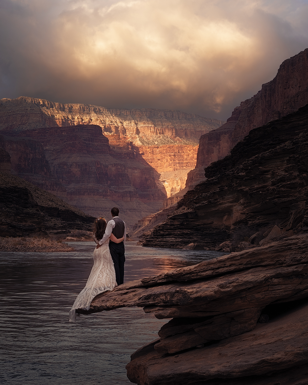 Natural Unions photograph of married couple standing on overhanging rock looking downstream on the Colorado River in Grand Canyon National Park